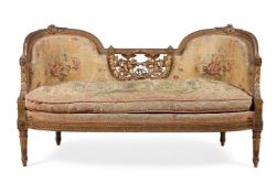 A FRENCH CARVED GILTWOOD AND TAPESTRY UPHOLSTERED SETTEE, THIRD QUARTER 19TH CENTURY