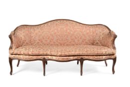 A CARVED WALNUT AND UPHOLSTERED SOFA, PROBABLY FRENCH, CIRCA 1760