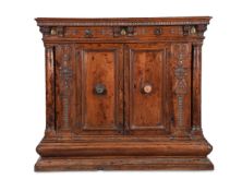 AN ITALIAN CARVED WALNUT SIDE CABINET, FIRST HALF 16TH CENTURY