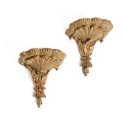 A PAIR OF GEORGE III CARVED GILTWOOD AND GREEN PAINTED WALL BRACKETS, CIRCA 1770