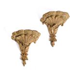 A PAIR OF GEORGE III CARVED GILTWOOD AND GREEN PAINTED WALL BRACKETS, CIRCA 1770