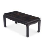 A BLACK LACQUERED LOW CENTRE TABLE