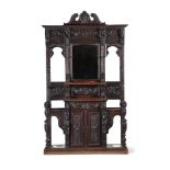 A CARVED OAK HALL STAND IN ANTIQUARIAN TASTE