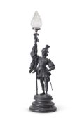 A CONTINENTAL SPELTER LAMP IN THE FORM OF A 17TH CENTURY MAN AT ARMS
