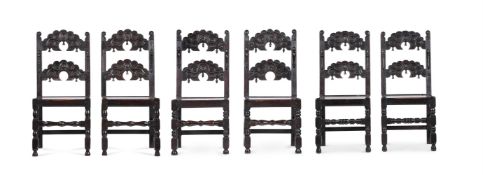 A SET OF SIX CARVED OAK CHAIRS IN 17TH CENTURY STYLE
