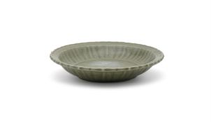 A large carved longquan celadon barbed dish