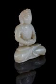 A Chinese celadon jade seated buddha