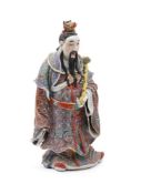 A large Chinese standing figure of an Immortal