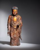An attractive Chinese lacquer and gilded sandalwood Buddha