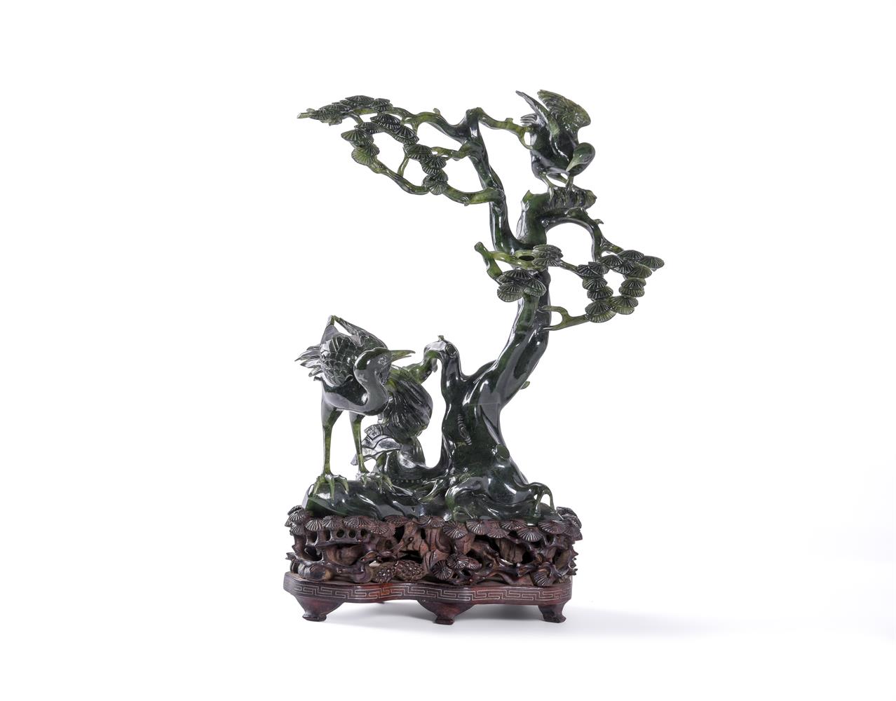 A Chinese spinach jade group of birds in a pine tree