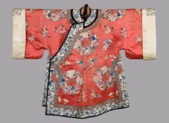 A Chinese coral red Chinese side fastening ladies three quarter length robe