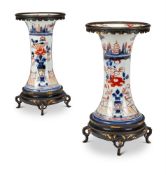 A pair of Japanese Imari and ormolu mounted trumpet vases