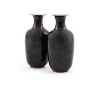 A pair of Chinese black glazed vases