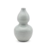 A Chinese celadon double gourd vase