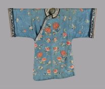 A Chinese sky-blue rich patterned damask women's side fastening robe