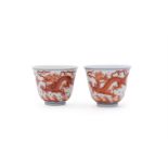 A pair of iron-red 'Dragon' wine cups