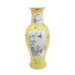 A Chinese yellow-ground famille rose sgraffito vase