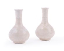 A pair of Chinese blanc de chine bottle vases