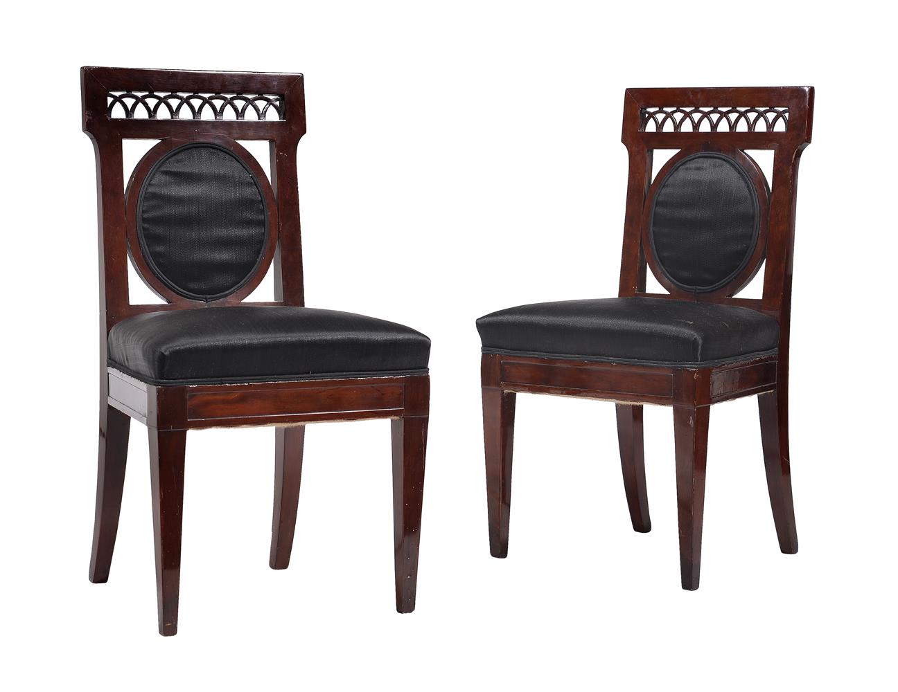 A SET OF FOUR CONTINENTAL MAHOGANY HALL CHAIRS