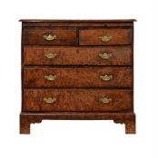 A GEORGE III BURR OAK CHEST OF DRAWERS