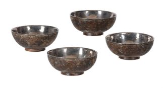 FOUR CHINESE CARVED COCONUT TEA BOWLS