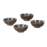 FOUR CHINESE CARVED COCONUT TEA BOWLS