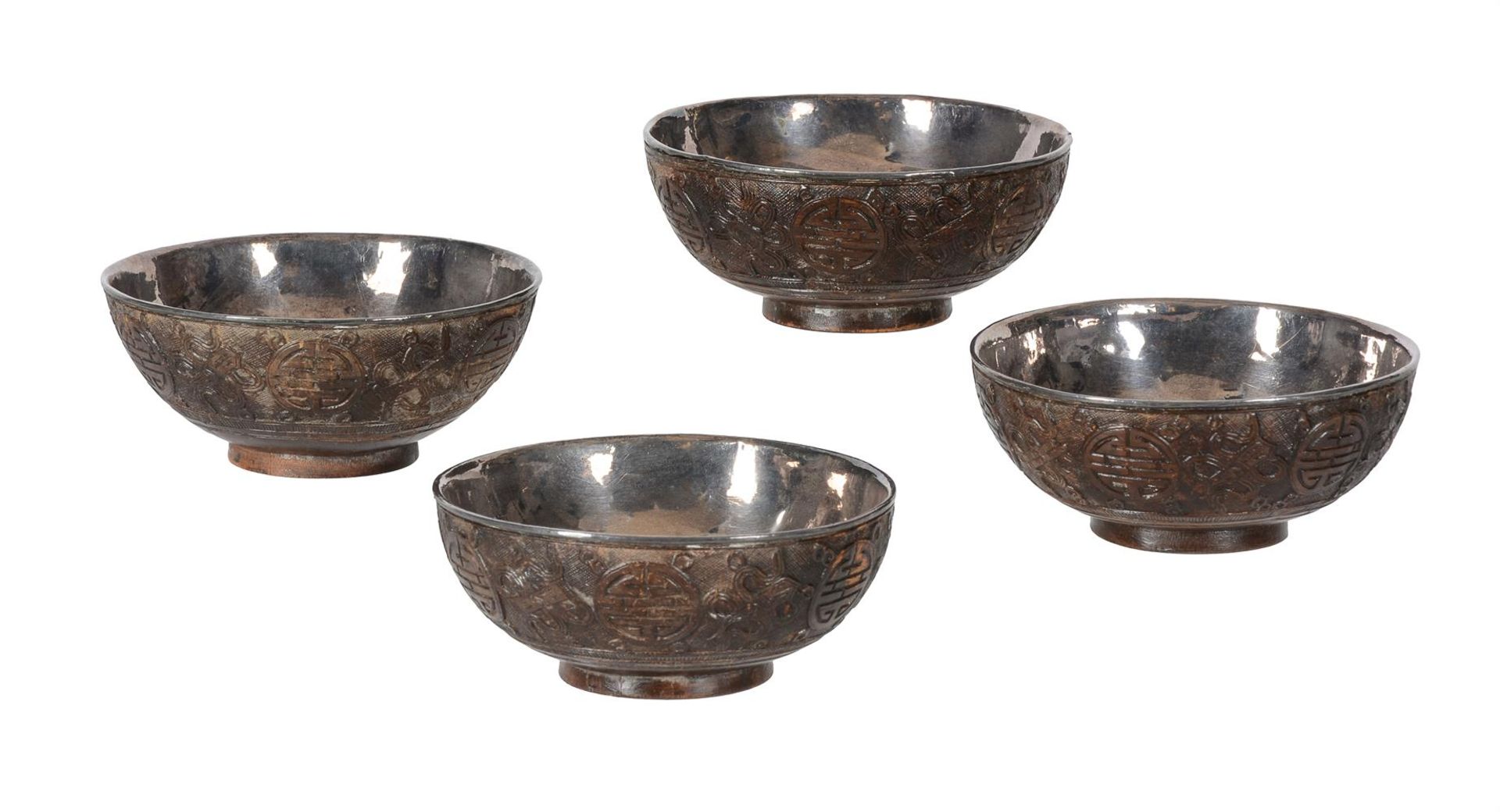 FOUR CHINESE CARVED COCONUT TEA BOWLS