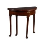 A GEORGE II MAHOGANY DEMI LUNE FOLDING TEA TABLE, CIRCA 1740