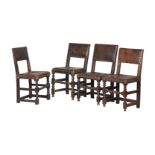 A HARLEQUIN SET OF EIGHT OAK AND LEATHER UPHOLSTERED CHAIRS