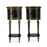 A PAIR OF FRENCH EBONISED AND GILT METAL MOUNTED BEDSIDE TABLES