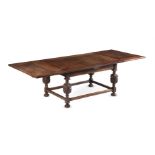 AN OAK DRAWER LEAF DINING TABLE IN 17TH CENTURY STYLE