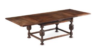 AN OAK DRAWER LEAF DINING TABLE IN 17TH CENTURY STYLE