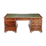 A MAHOGANY PEDESTAL DESK IN GEORGE IV STYLE