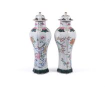 A PAIR OF FAMILLE ROSE VASES AND COVERS