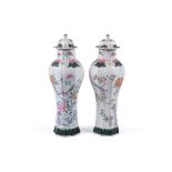 A PAIR OF FAMILLE ROSE VASES AND COVERS