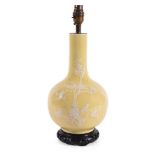 A CHINESE YELLOW GROUND WHITE ENAMELLED VASE