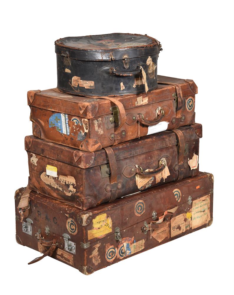 A GROUP OF THREE VARIOUS BROWN LEATHER TRAVELLING TRUNK