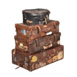 A GROUP OF THREE VARIOUS BROWN LEATHER TRAVELLING TRUNK