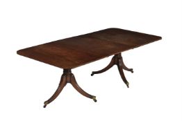 A MAHOGANY DINING TABLE IN GEORGE III STYLE