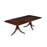 A MAHOGANY DINING TABLE IN GEORGE III STYLE