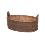 AN OAK AND METAL BOUND COOPERED OVAL BUCKET