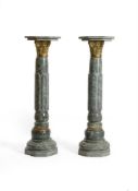 A PAIR OF GREEN MARBLE AND GILT METAL MOUNTED COLUMNS