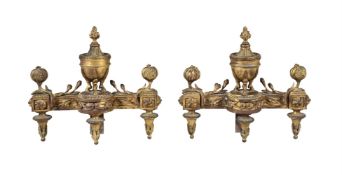 A PAIR OF GILT METAL CHENETS IN LOUIS XVI STYLE