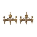 A PAIR OF GILT METAL CHENETS IN LOUIS XVI STYLE