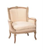 A FRENCH GREY PAINTED CARVED BEECH AND UPHOLSTERED ARMCHAIR IN LOUIS XVI STYLE