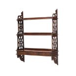 AN EDWARDIAN FLIGHT OF THREE MAHOGANY WALL SHELVESCIRCA 1905, AFTER THE MANNER OF THOMAS CHIPPENDALE