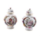 A PAIR OF DRESDEN FLOWER-ENCRUSTED BALUSTER VASES AND DOMED COVERS