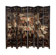A LARGE BLACK LACQUER EIGHT FOLD SCREEN