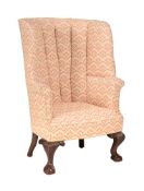 A MAHOGANY AND UPHOLSTERED BARREL BACK ARMCHAIR IN GEORGE III STYLE