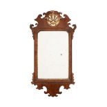 A GEORGE II WALNUT AND PARCEL GILT WALL MIRROR